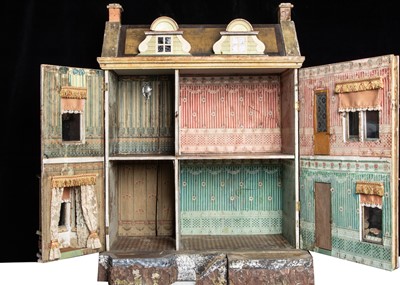 Lot 26 - A Gottschalk wooden dolls’ house raised on a bark base