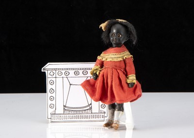 Lot 40 - A German black swivel head dolls’ house doll