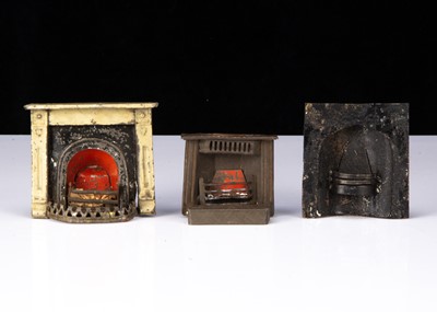 Lot 43 - Three 19th century painted tinplate dolls’ house fireplaces