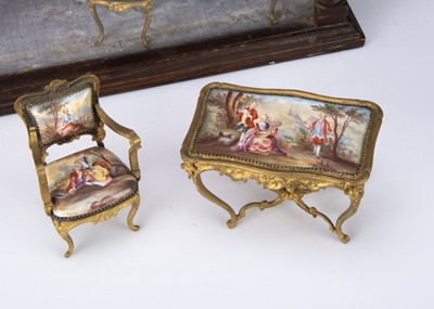 Lot 64 - A set of early 20th century Viennese enamel and gilt metal dolls’ house furniture