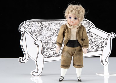 Lot 70 - A Kestner 131 all-bisque swivel head dolls’ house boy doll