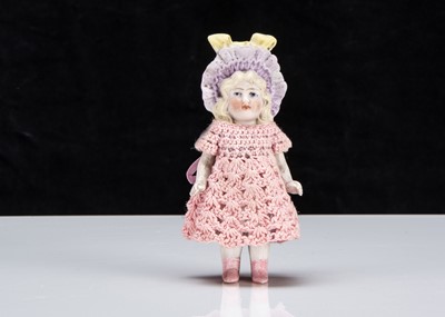 Lot 73 - A Hertwig all-bisque dolls’ house doll with moulded bonnet
