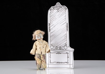 Lot 76 - An unusual German bisque headed dolls’ house white faced clown