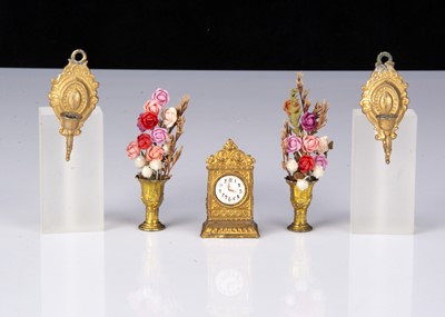 Lot 82 - A German gilt-metal dolls’ house mantel clock
