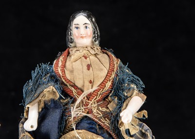 Lot 89 - A rare 19th century Kister pink tinted china shoulder-head dolls’ house doll with jointed wooden body