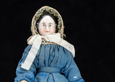 Lot 90 - A rare 19th century Kister pink tinted china shoulder-head dolls’ house doll with jointed wooden body