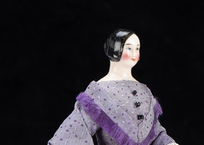 Lot 92 - A rare 19th century Kister pink tinted china shoulder-head dolls’ house doll with jointed wooden body