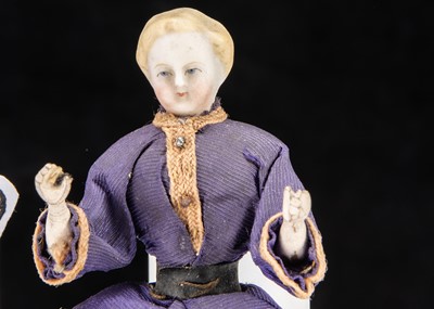 Lot 93 - A rare bisque shoulder-head dolls’ house boy doll with jointed wooden body