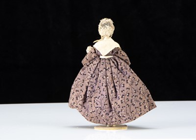 Lot 95 - A 19th century Grodnerthal dolls’ house doll with baby