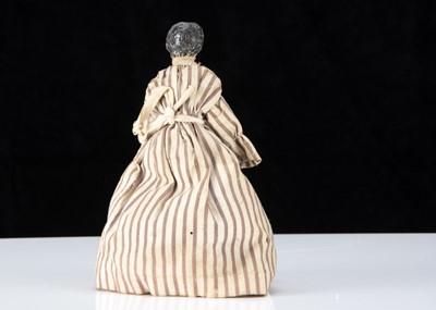Lot 100 - A 19th century composition ‘alien’ headed dolls’ house nursery maid with Grodnerthal baby