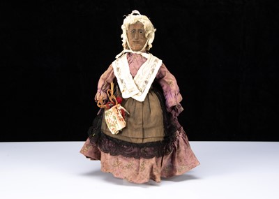 Lot 106 - An unusal 19th century English wooden Folk Art elderly lady doll