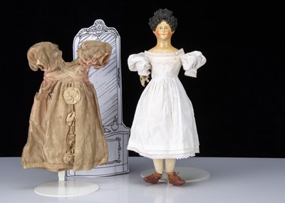 Lot 109 - A mid 19th century German papier-mâché shoulder head doll with Apollo Knot hair