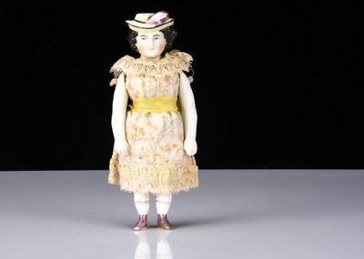 Lot 113 - A rare 19th century bisque shoulder-head doll with moulded hat