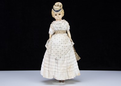 Lot 136 - A rare German 19th century wax over composition shoulder head doll with moulded hat