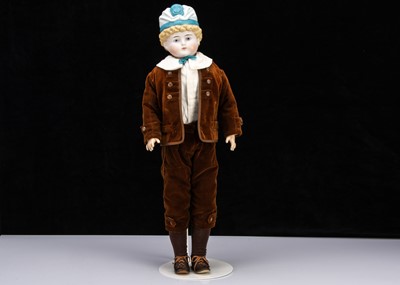 Lot 180 - A rare large Alt, Beck & Gottschalck bisque shoulder head boy doll with moulded hat