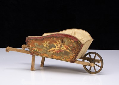 Lot 183 - A French lithographed tinplate and wooden dolls’ wheelbarrow