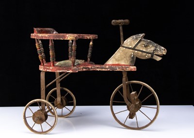 Lot 186 - A carved and painted wooden horse tricycle circa 1900