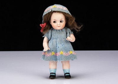 Lot 209 - A small German all-bisque 401 googly eyed girl doll