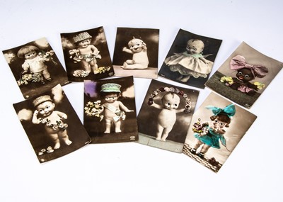 Lot 218 - Nine real photograph postcard featuring googly eyed dolls with glass googly eye