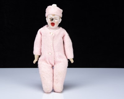 Lot 224 - An unusual pink bisque shoulder-head baby doll with fly on face