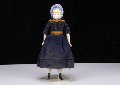 Lot 238 - A German bisque shoulder-head doll with moulded bonnet