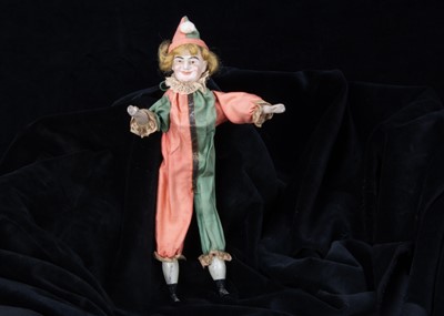 Lot 250 - An unusual bisque headed squeak toy clown