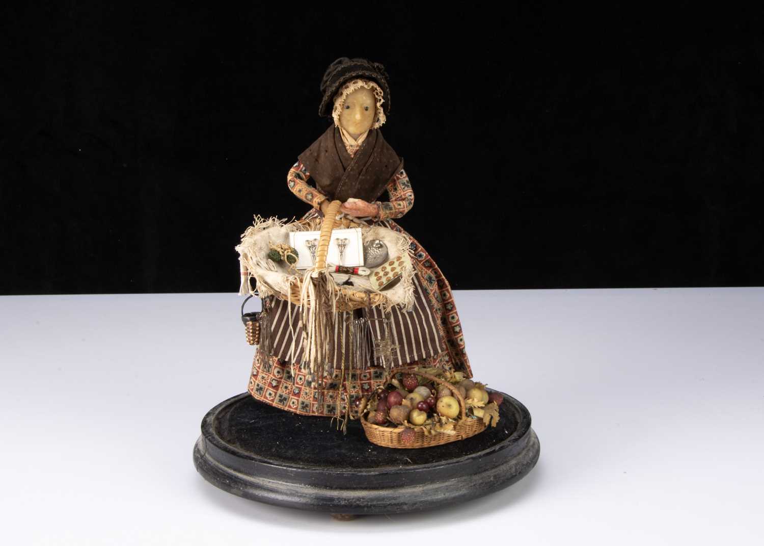 Pedlar Assistant Lot 265 - A rare 19th century beeswax pedlar doll,