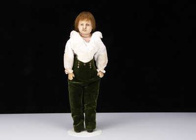 Lot 270 - An unusual mid 19th century English poured wax boy doll