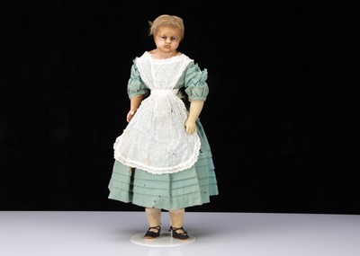 Lot 273 - A mid 19th century English poured wax child doll