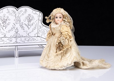 Lot 284 - A small German bisque headed bride doll