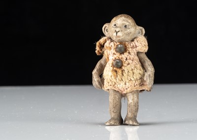 Lot 303 - A Hertwig all-bisque dolls’ house monkey boy doll