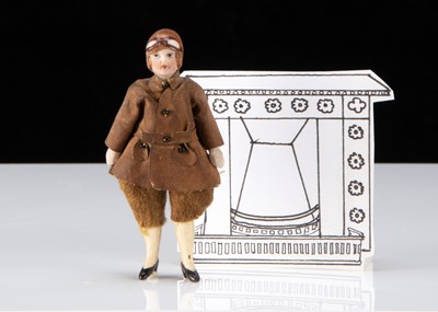 Lot 312 - An all-bisque dolls’ house female pilot doll