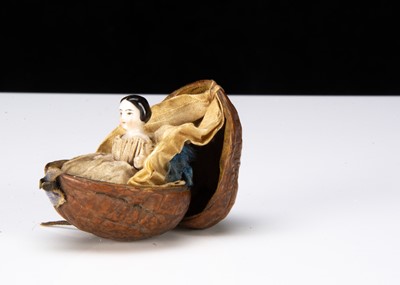 Lot 327 - A rare 19th century china Frozen Charlotte in a walnut shell
