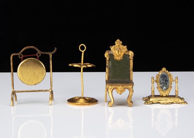 Lot 335 - Four German gilt metal dolls’ house items