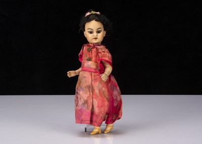 Lot 355 - A small German Asian child doll
