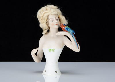 Lot 377 - A rare Goebels bisque half doll holding a parrot
