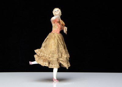 Lot 381 - A German half-doll playing a tambourine