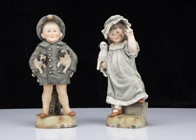Lot 394 - A pair of Hertwig children with their dogs