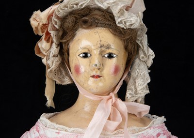 Lot 399 - A rare early 19th century English papier-mâché shoulder-head doll