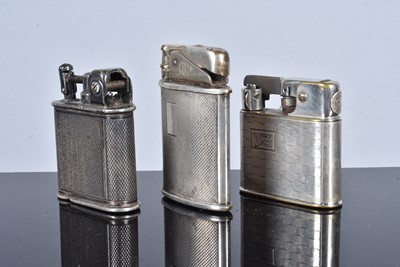 Lot 297 - Three silver plated pocket lighters