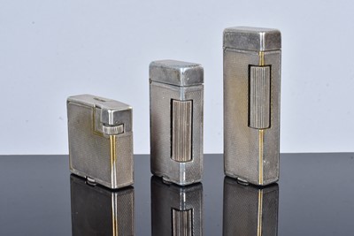 Lot 299 - Three silver plated Dunhill pocket lighters