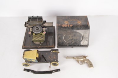 Lot 407 - Tin Toys including Burnett Car pars and Gerbruder Schmidt Typewriter and metal Toy Gun