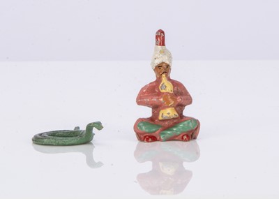 Lot 534 - Wend al aluminium rare Snake Charmer with coiled snake