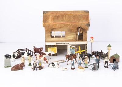 Lot 556 - Wooden agricultural or farm building possibly by Amersham Toys with a lot of lead figures and accessories comprising Britains farm workers (46, though 20 repaired or repainted)