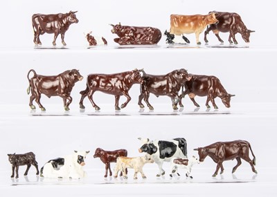 Lot 558 - A lot of lead farm bovine animals comprising Britains standing (4) lying (5) and feeding (8) cows