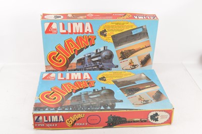 Lot 716 - Pair of Lima 0 Gauge Giant Goods Train Sets and Track Pack (3)