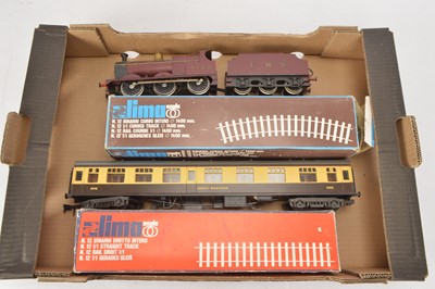 Lot 745 - Lima 0 Gauge 2-Rail Locomotive and Coach and oval of track (5, including tender)