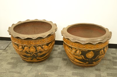 Lot 360 - A pair of large and impressive dragon designed plant pots