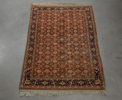 Lot 402 - A machine made rug