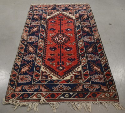 Lot 404 - A Persian woollen rug